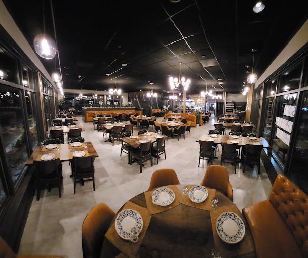 The main dining room under gold chandeliers